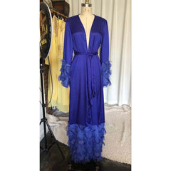 Stylish Muslim women's long robe in a solid color with ruffled sleeves, featuring a fashionable blue hue