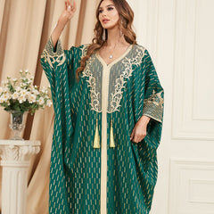 Unique style unfolds in a jalabiya , Adorned with golden foil accents , Embroidered appliques , Fringe detailing, Exuding a distinctive charm