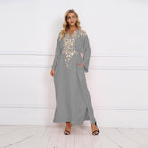 Embroidered pocketed elegant Muslim long dress with a cinched waist