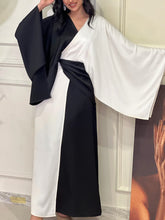 Elegant satin dress with black and white contrast stitching