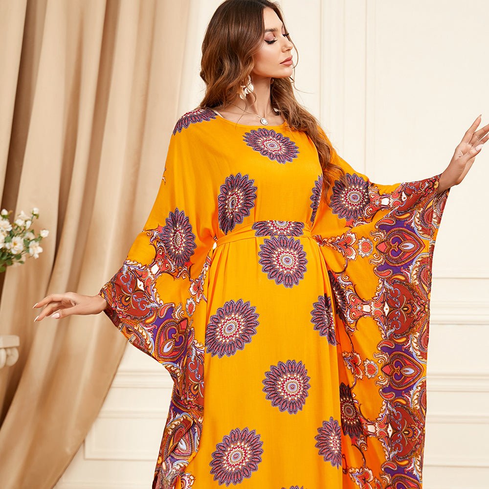 Jalabiya Flatter your figure with a waist-cinching jalabiya, featuring loose batwing sleeves and a touch of luxury in the print