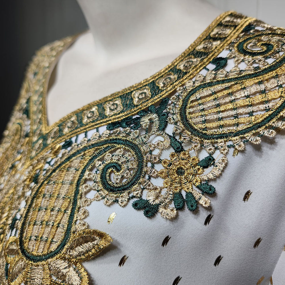 Jalabiya Discover the essence of understated elegance with a jalabiya | adorned with delicate lace | gold foil accents | embroidered appliques | and a minimalist allure