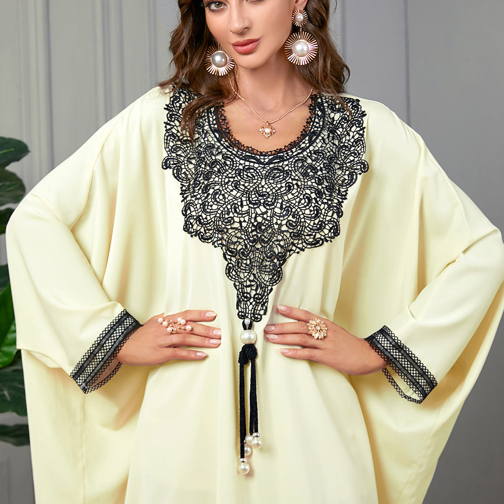 Embrace the charm of a jalabiya with embroidered appliques ,Delicate lace trim on the cuffs ,Tassel accents , Loose-fitting batwing sleeves