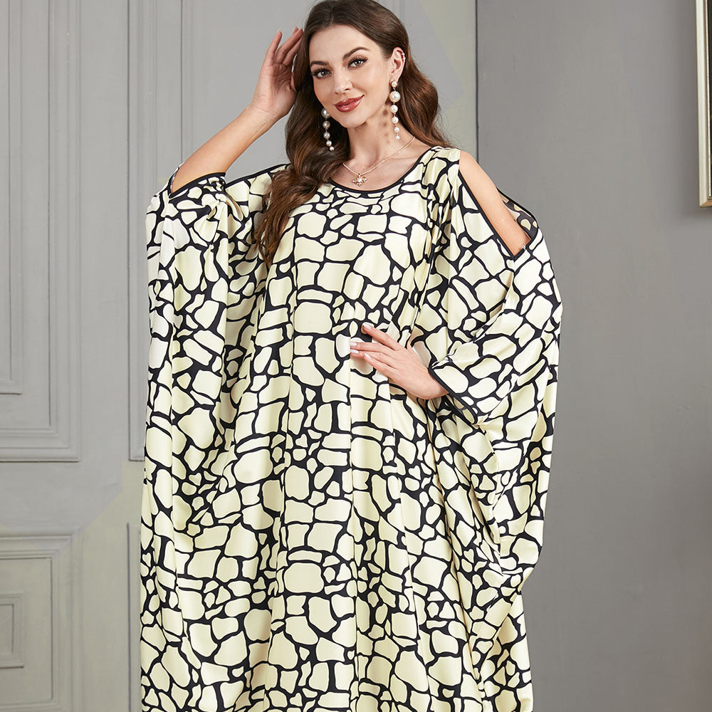 Loose-fitting jalabiya with batwing sleeves , Off-shoulder style , Black and white textured print