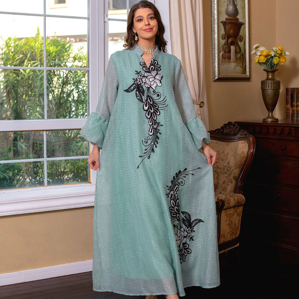 Jalabiya Elevate your style with a fashionable and avant-garde jalabiya | featuring embroidered appliques | bell sleeves | a waist-cinching tie | and a contemporary edge