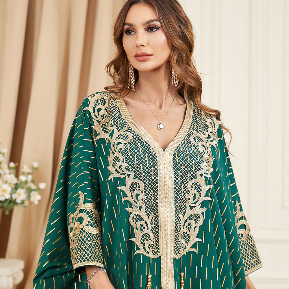 Unique style unfolds in a jalabiya , Adorned with golden foil accents , Embroidered appliques , Fringe detailing, Exuding a distinctive charm