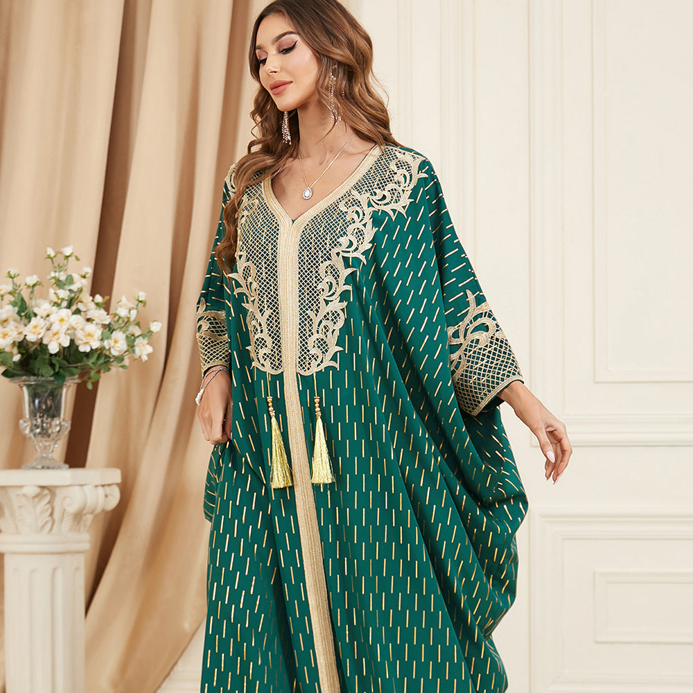 Unique style unfolds in a jalabiya , Adorned with golden foil accents , Embroidered appliques , Fringe detailing, Exuding a distinctive charm