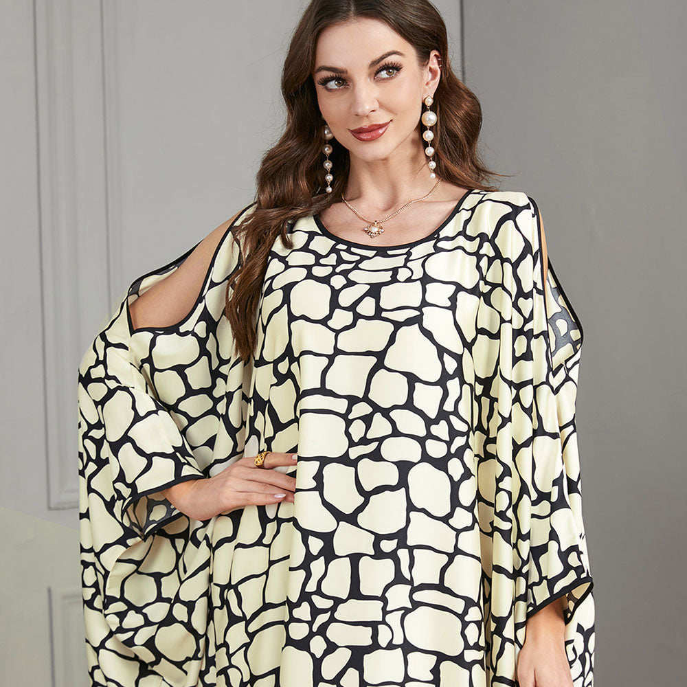 Loose-fitting jalabiya with batwing sleeves , Off-shoulder style , Black and white textured print