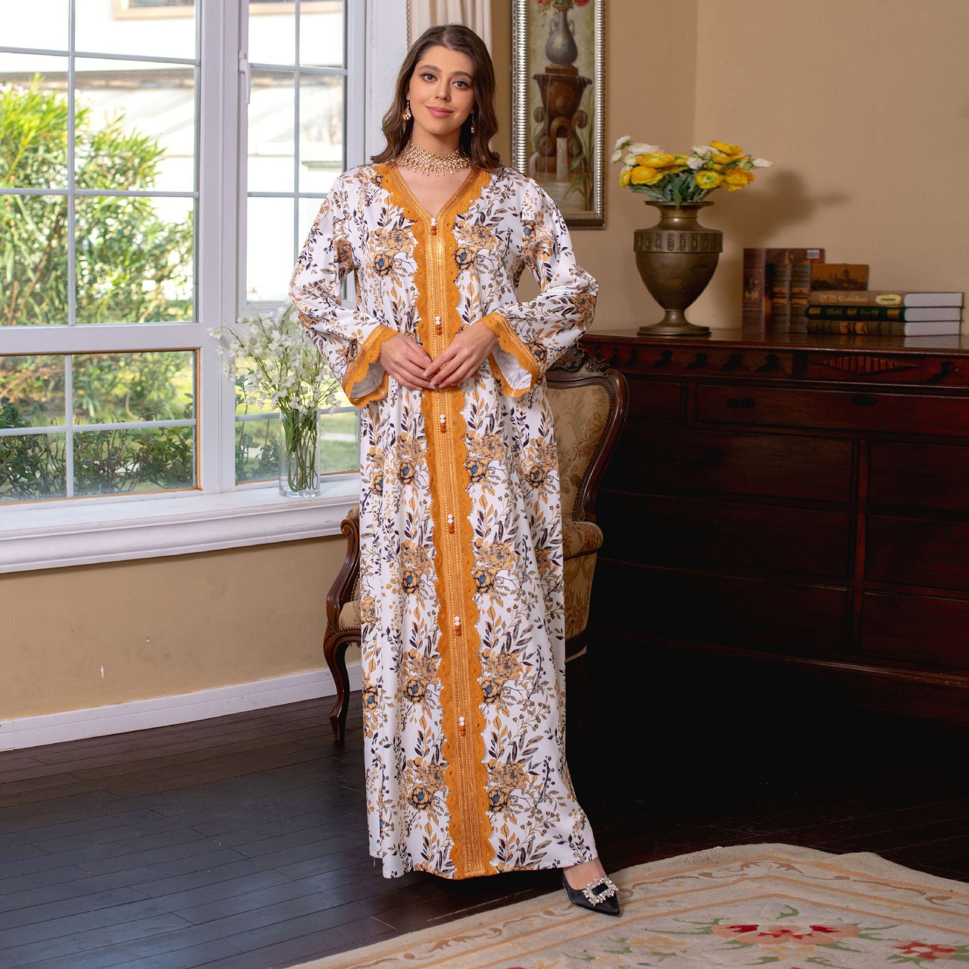 Immerse yourself in the comfort of a printed jalabiya, featuring a relaxed, flowy silhouette , intricate lace trimmings , and a casual yet stylish design