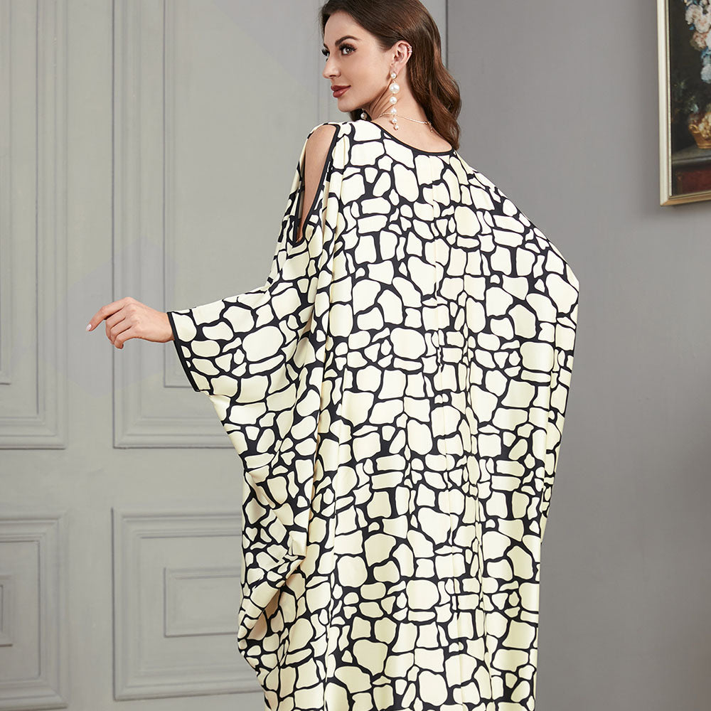 Loose-fitting jalabiya with batwing sleeves , Off-shoulder style , Black and white textured print