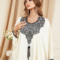 Embrace the charm of a jalabiya with embroidered appliques ,Delicate lace trim on the cuffs ,Tassel accents , Loose-fitting batwing sleeves