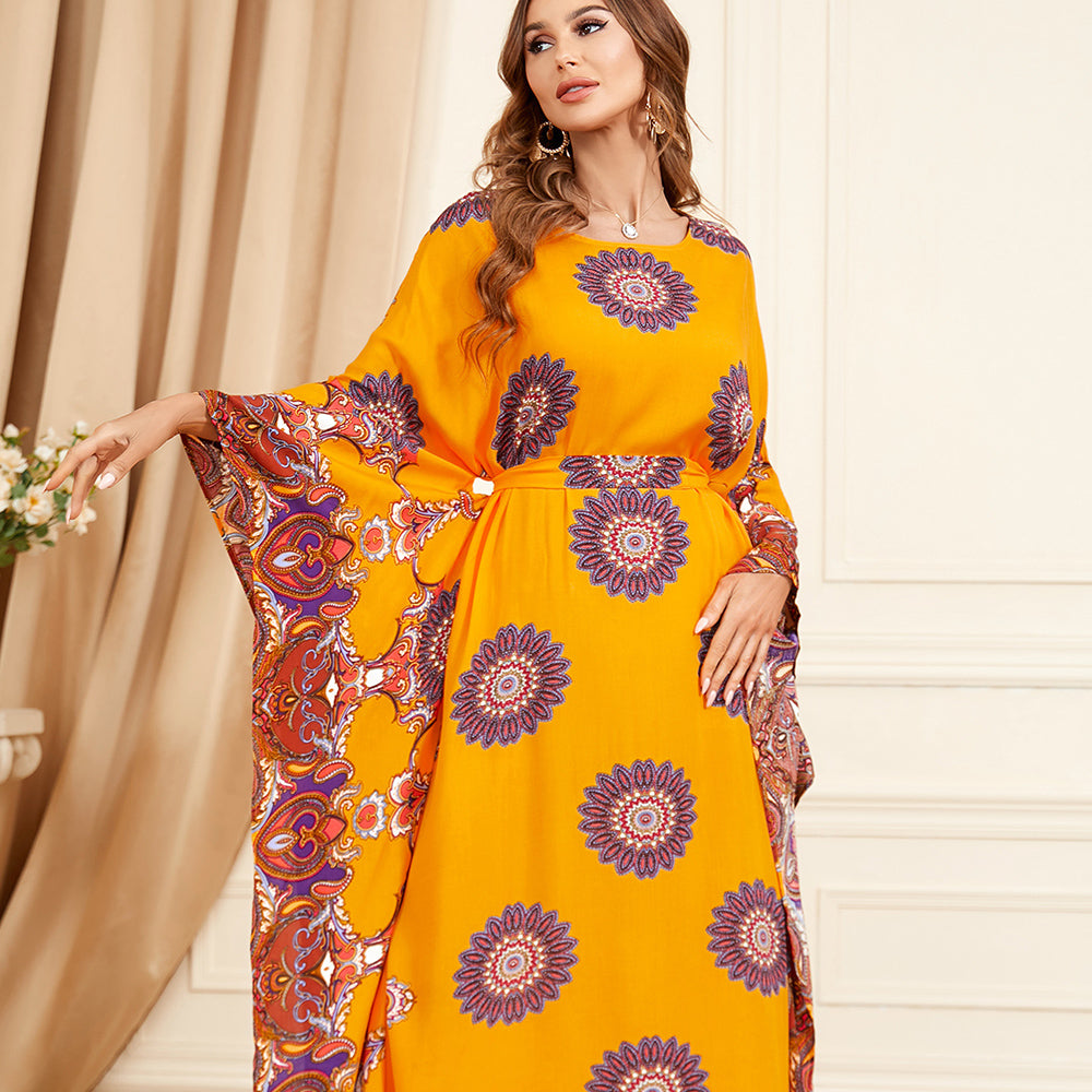 Jalabiya Flatter your figure with a waist-cinching jalabiya, featuring loose batwing sleeves and a touch of luxury in the print