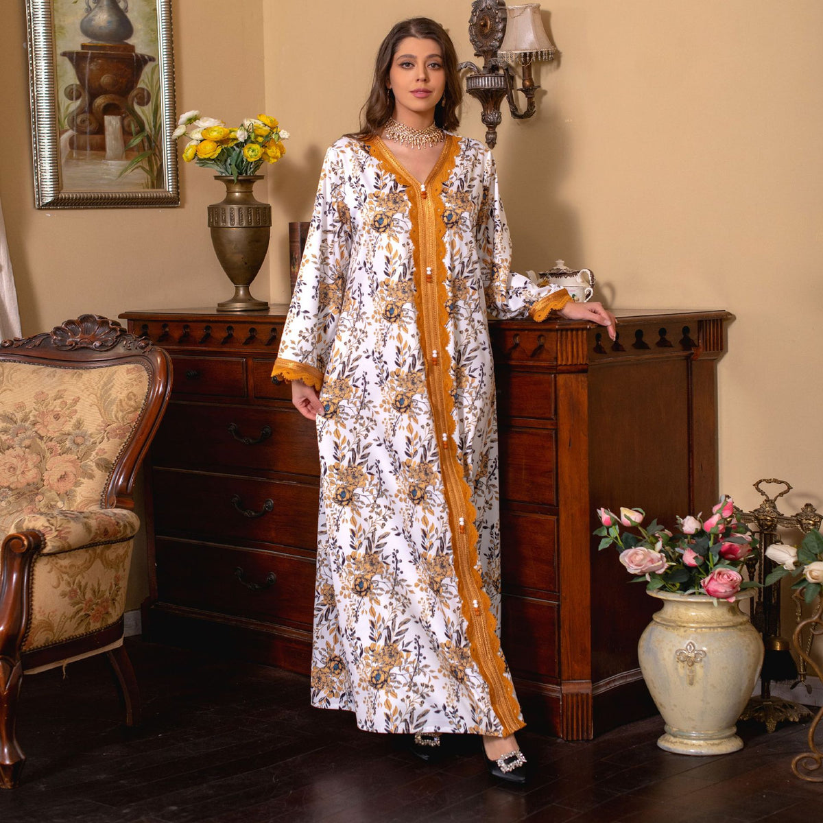 Immerse yourself in the comfort of a printed jalabiya, featuring a relaxed, flowy silhouette , intricate lace trimmings , and a casual yet stylish design