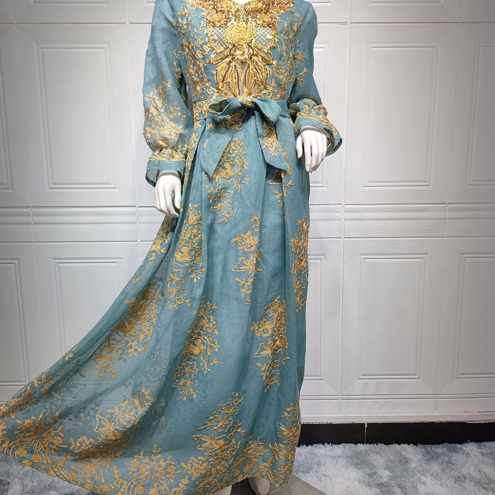 Jalabiya Embrace elegance with an embroidered jalabiya adorned with appliques | a floor-length evening robe | a waist-cinching belt | and an aura of grace