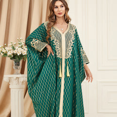 Unique style unfolds in a jalabiya , Adorned with golden foil accents , Embroidered appliques , Fringe detailing, Exuding a distinctive charm