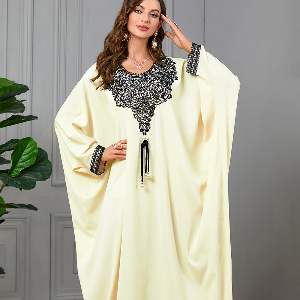 Embrace the charm of a jalabiya with embroidered appliques ,Delicate lace trim on the cuffs ,Tassel accents , Loose-fitting batwing sleeves