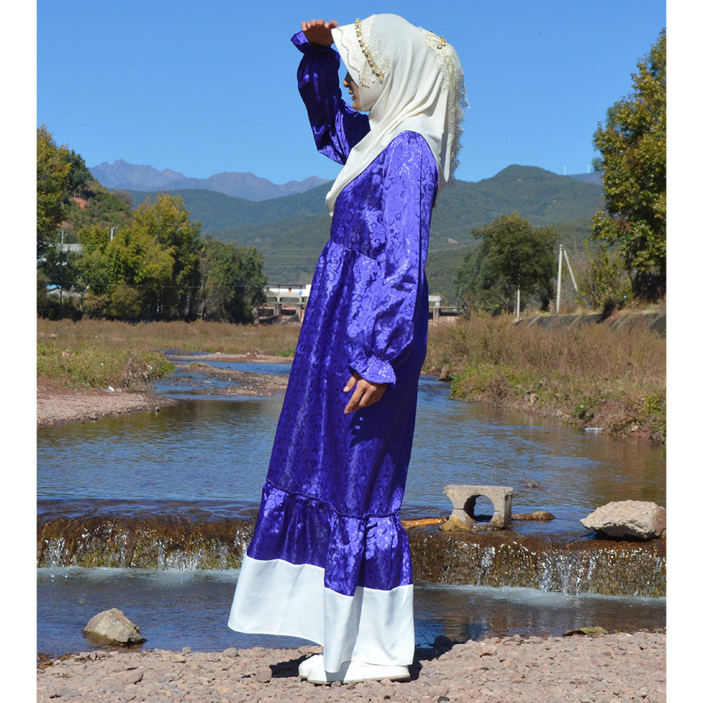 Sweet and fresh Muslim fashion dress for women with a charming ruffled hem and puffed sleeves