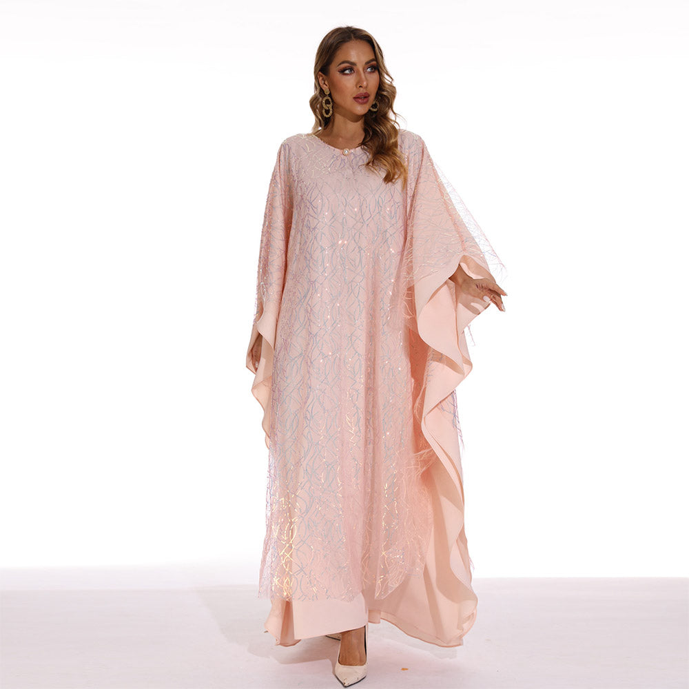 Muslim women's long dress with batwing sleeves, adorned with embroidered details and sparkling sequins, exuding an elegant and graceful charm