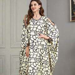 Loose-fitting jalabiya with batwing sleeves , Off-shoulder style , Black and white textured print