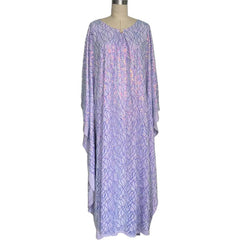 Muslim women's long dress with batwing sleeves, adorned with embroidered details and sparkling sequins, exuding an elegant and graceful charm