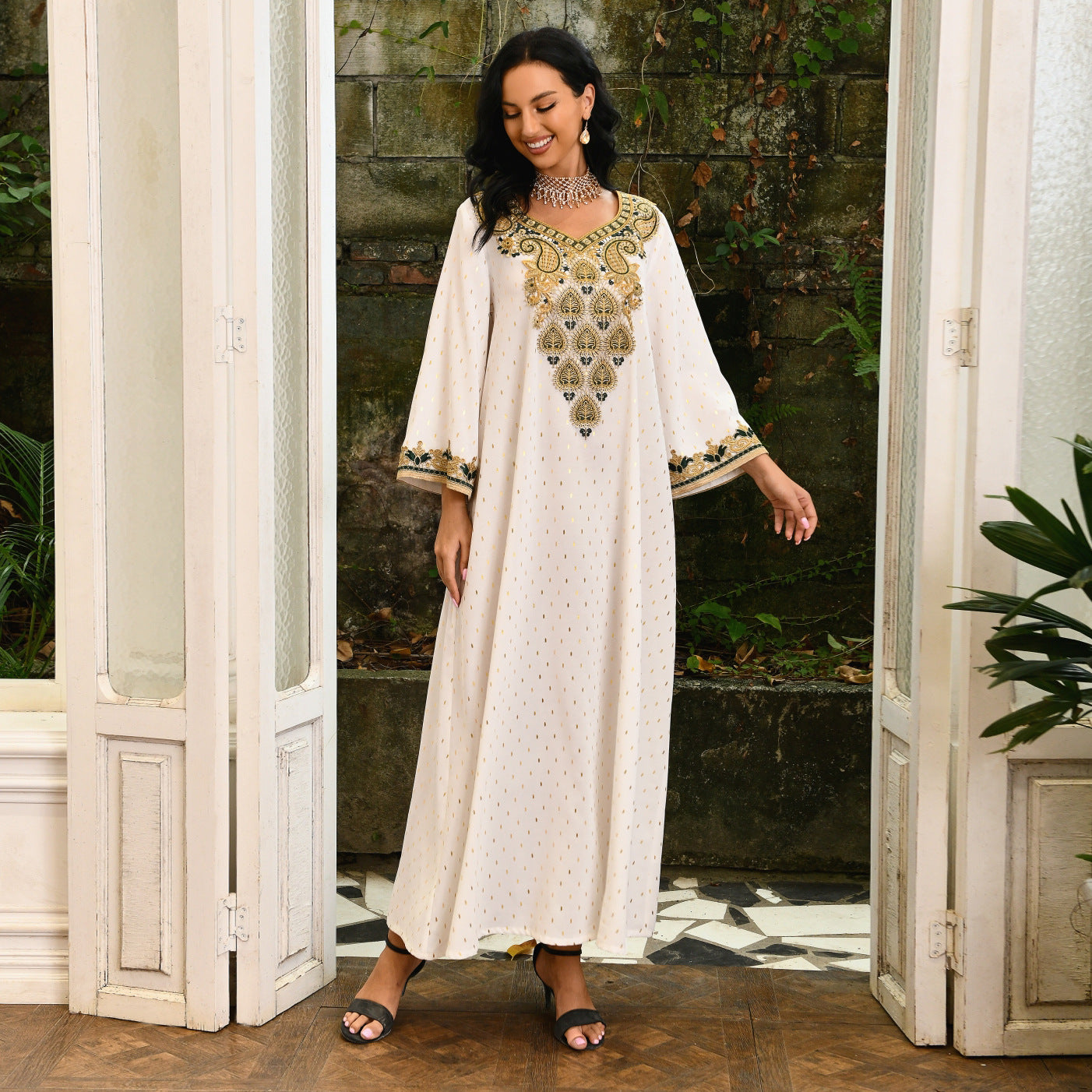 Jalabiya Discover the essence of understated elegance with a jalabiya | adorned with delicate lace | gold foil accents | embroidered appliques | and a minimalist allure