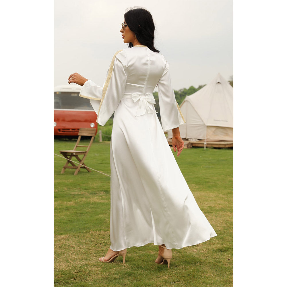 Muslim women's elegant long dress in pure white with long sleeves