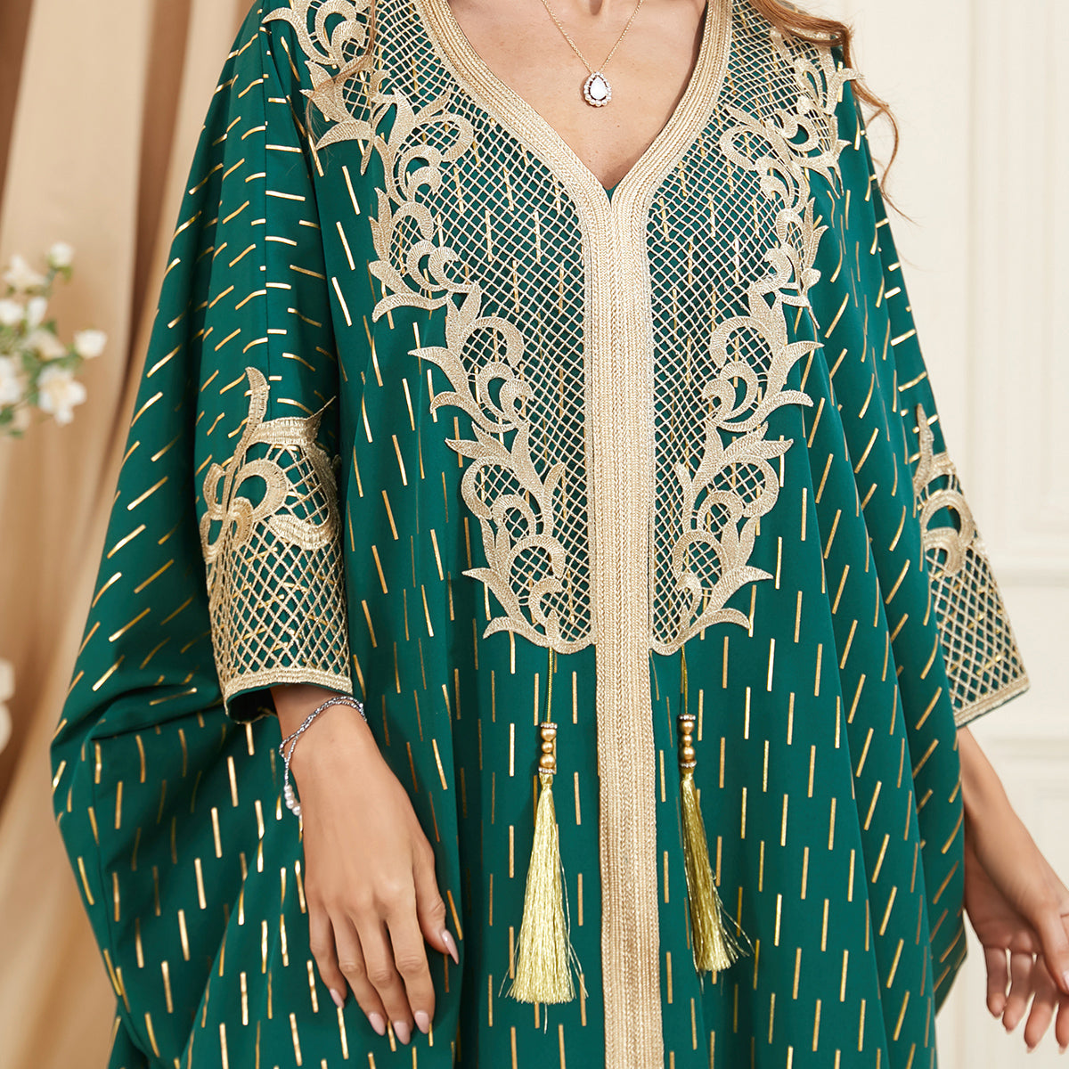 Unique style unfolds in a jalabiya , Adorned with golden foil accents , Embroidered appliques , Fringe detailing, Exuding a distinctive charm