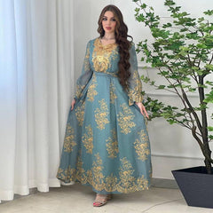 Jalabiya Embrace elegance with an embroidered jalabiya adorned with appliques | a floor-length evening robe | a waist-cinching belt | and an aura of grace