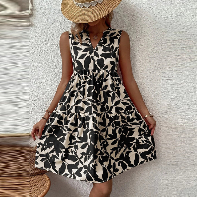 فساتين صيفية أنيقة للسيدات بطباعة نباتية وفتحة رقبة على شكل V فستان مكشكش بوهو بدون أكمام فضفاض لقضاء إجازة الشاطئ وتنورة قصيرة