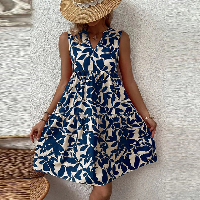 فساتين صيفية أنيقة للسيدات بطباعة نباتية وفتحة رقبة على شكل V فستان مكشكش بوهو بدون أكمام فضفاض لقضاء إجازة الشاطئ وتنورة قصيرة