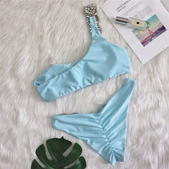 European and American bikini sexy crystal diamond bandage hollow solid color split female swimsuit one shoulder swimsuit